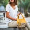 Astra es un mini bolso amarillo ocre en piel y base de palma trenzada bloverbags 2018